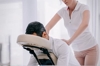 Corporate office chair massage treatment.